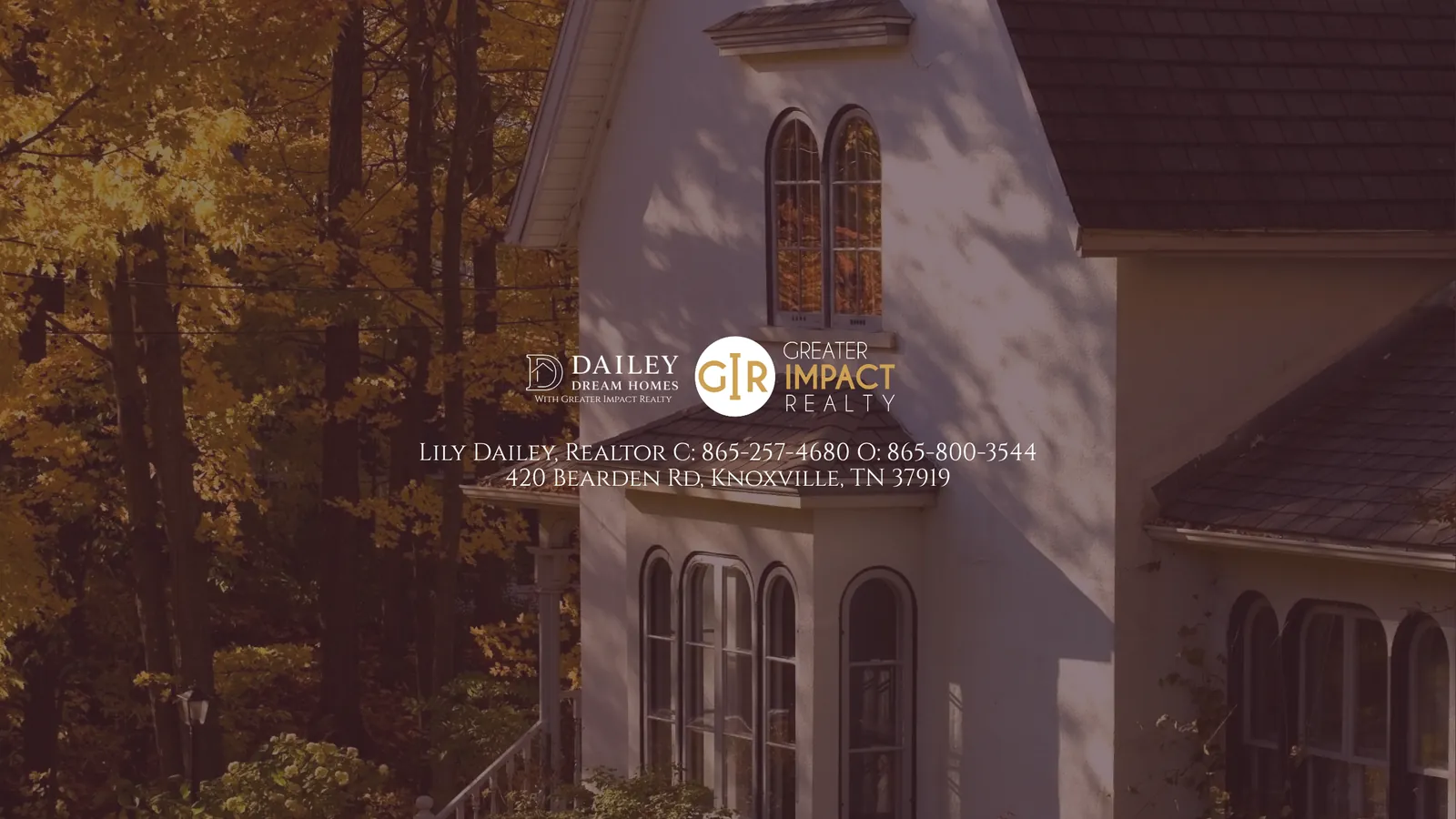 A Knoxville home with arched windows framed by yellow autumn trees
